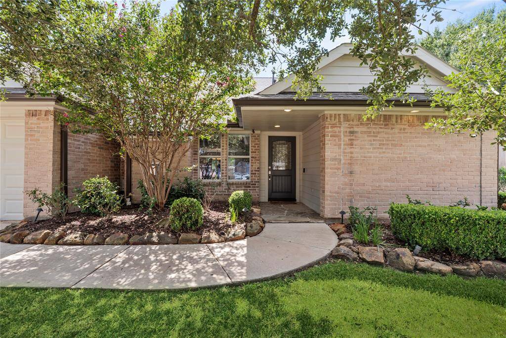 Finely crafted, the elegantly appointed brickwork entices the senses, while the charming stone-bordered flower beds add color and texture to the exterior.