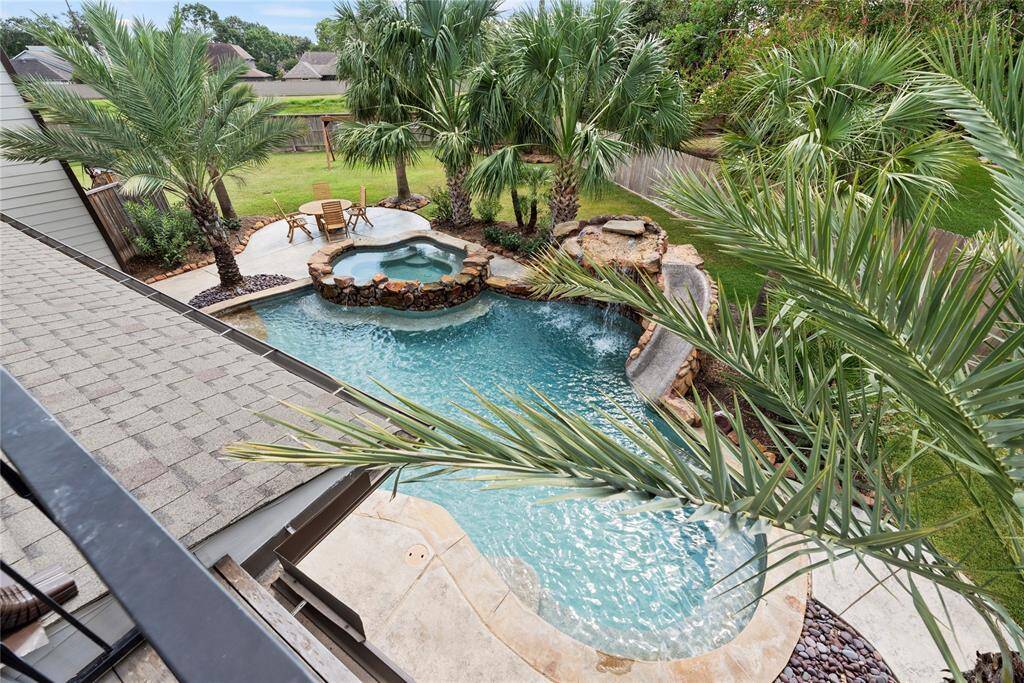Have an oasis escape everyday with your Caribbean-inspired backyard! Boasting a sparkling swimming pool and spa, parties and get-togethers are sure to include floaties, pool noodles, and inflatable flamingos!