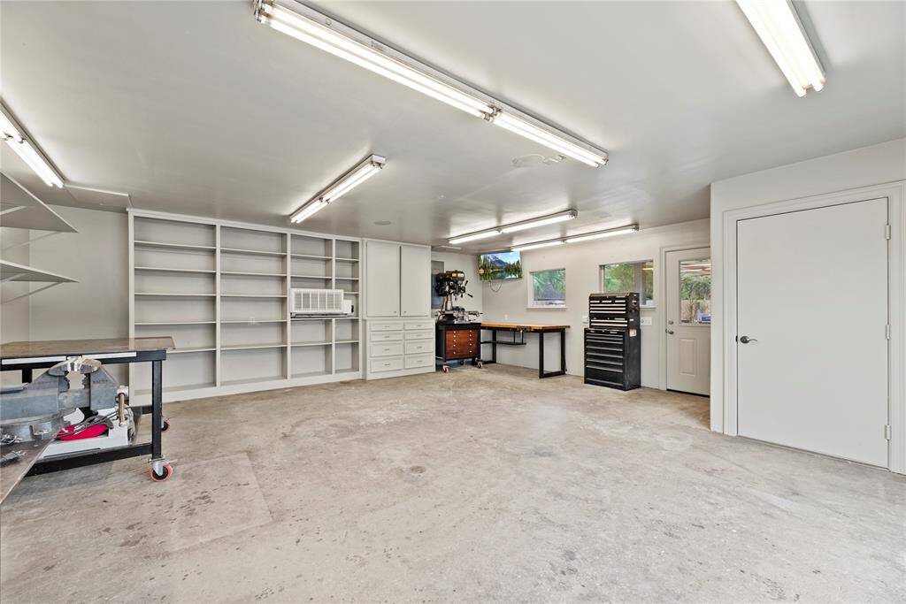 The storage shop features cabinets, providing ample organized space for tools, equipment, and supplies.