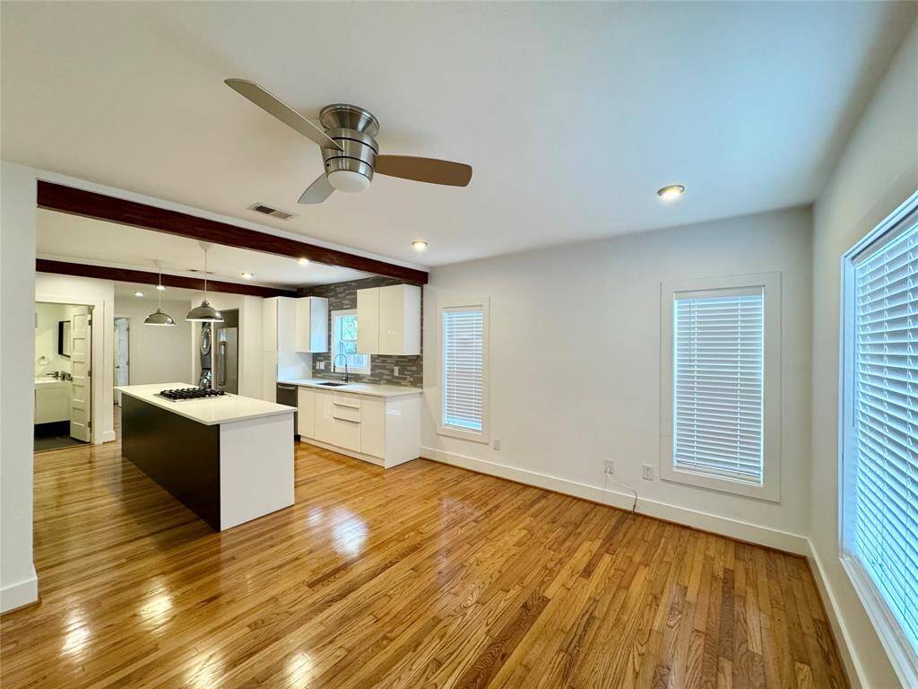 Living area is flooded with natural light and spills easily into kitchen area.