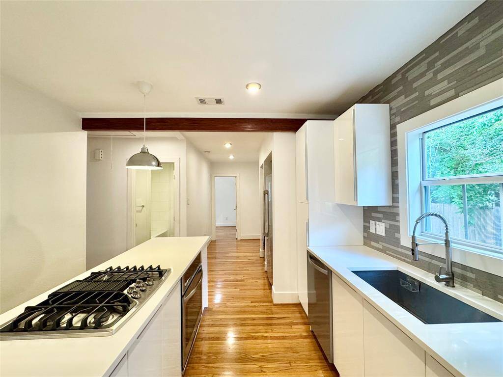 Layout of kitchen is functional and efficient! Nice bug window over a nice big basin style stainless steel sink!