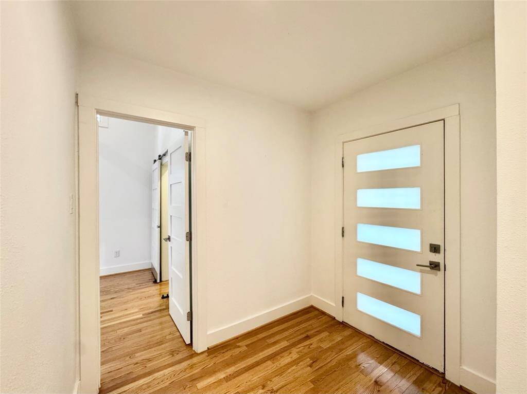 Small vestibule area for back door. Perfect for a little bench and storage for a "mudroom".