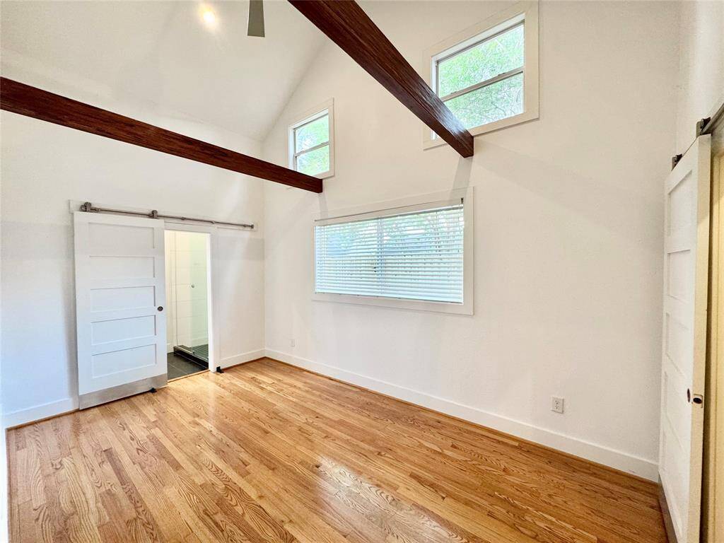 Master suite is an airy retreat with these soaring vaulted ceilings!