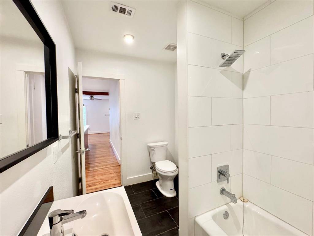 Shared hallway bath is spacious and well organized! Lovely bathroom fixtures and white tile for a modern contemporary look!