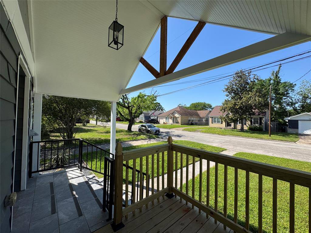 Enjoy the shade looking at onto the pleasant neighborhood streetscape!