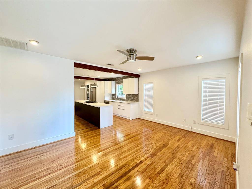 SPACIOUS AND BRIGHT! Clean white walls and polished warm wood floors!