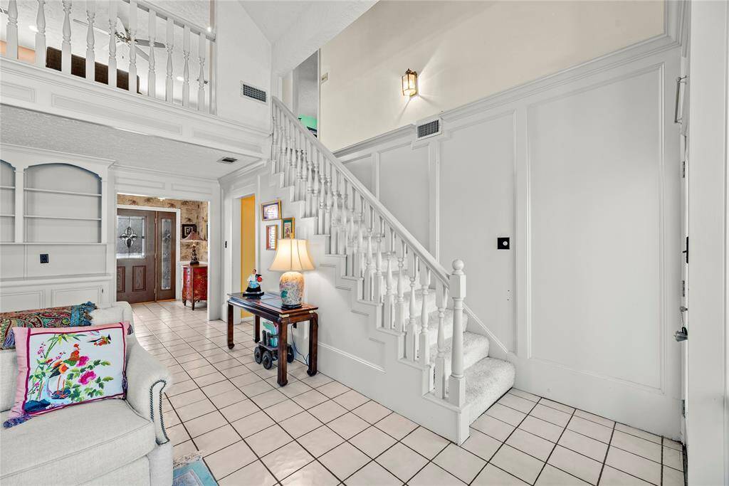Staircase leading to the second floor from the large first floor living room.
