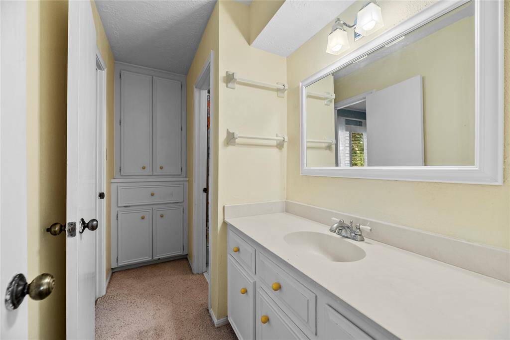 Bathroom # 2 with sink and vanity space connecting to 2 of the upstairs bedrooms.