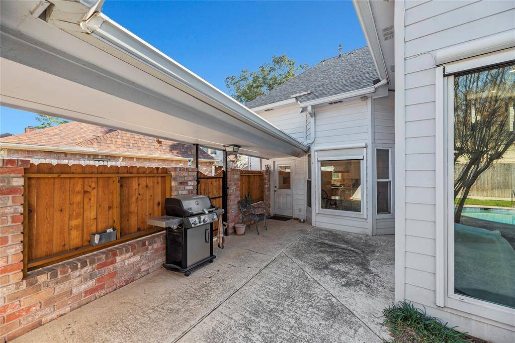 Backyard patio area ideal for outdoor cooking and activities.