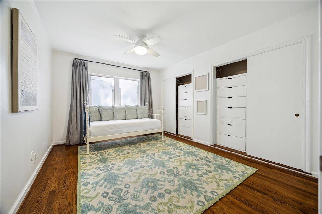 The first-floor study is lined with custom built-in bookcases, cleverly concealing a hidden storage space beyond. Crown molding, recessed lighting, and a soft designer palette add polish to the versatile room. Ideal as a private office or sixth bedroom, this space adapts effortlessly to your lifestyle.