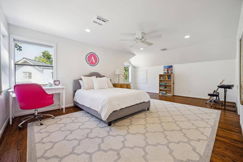 A charming study or lounge area is nestled between the upstairs guest suites. A cozy spot to unwind, read, or work from home. Sophisticated and quiet, it offers a touch of luxury above the main floor.