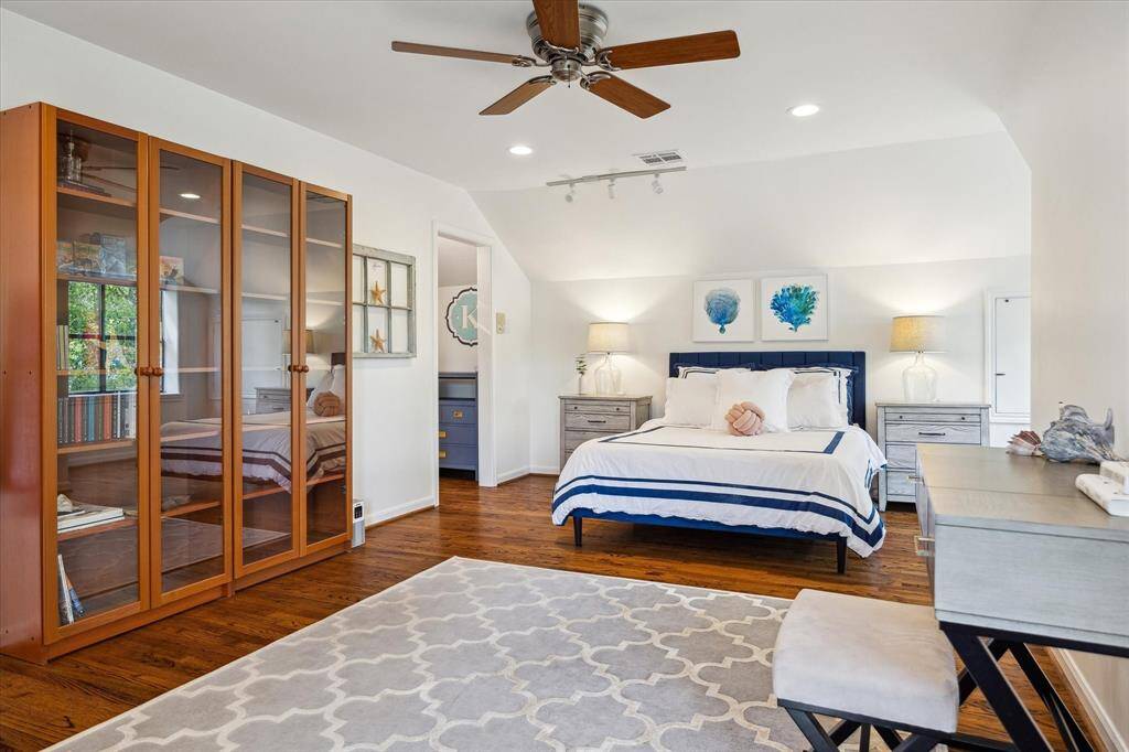 Secondary bedroom #2 is generously sized with space for a sitting area and desk. A walk-in closet and ensuite bath offer private comfort. It’s a beautifully appointed guest or family suite.