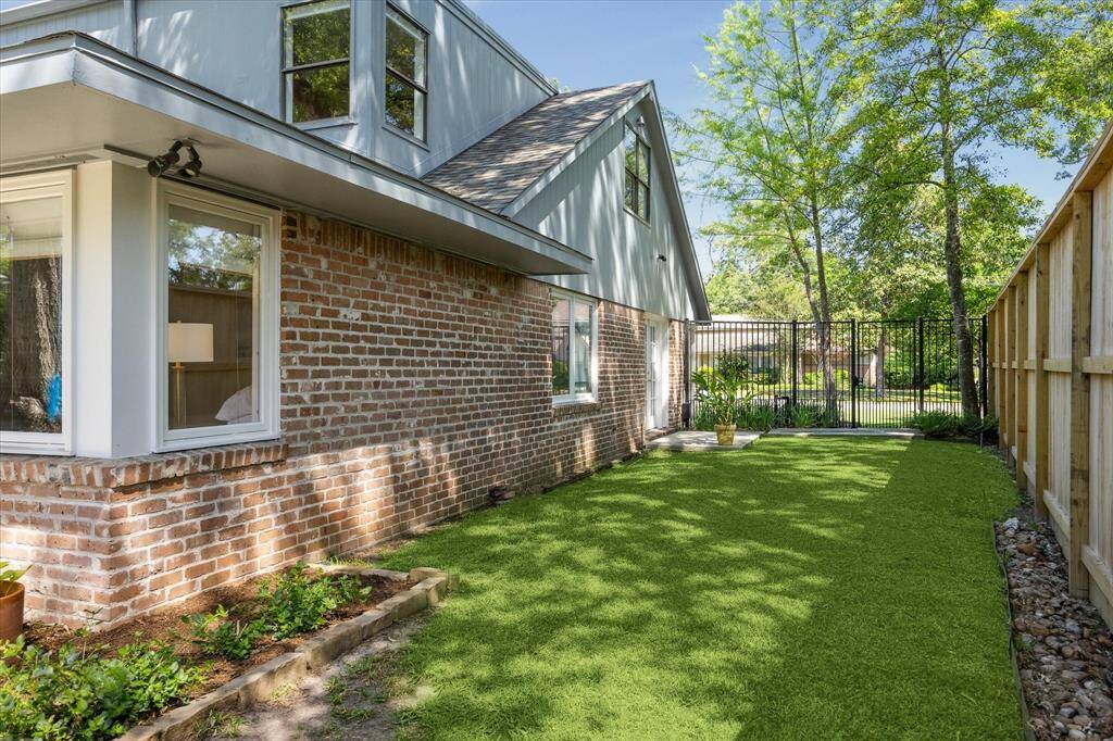 The sprawling backyard offers natural grass, artificial turf, and defined sitting areas perfect for lounging or play. With ample room to add a pool, this outdoor space is ready to become your personal retreat. Designed for year-round enjoyment and effortless entertaining.