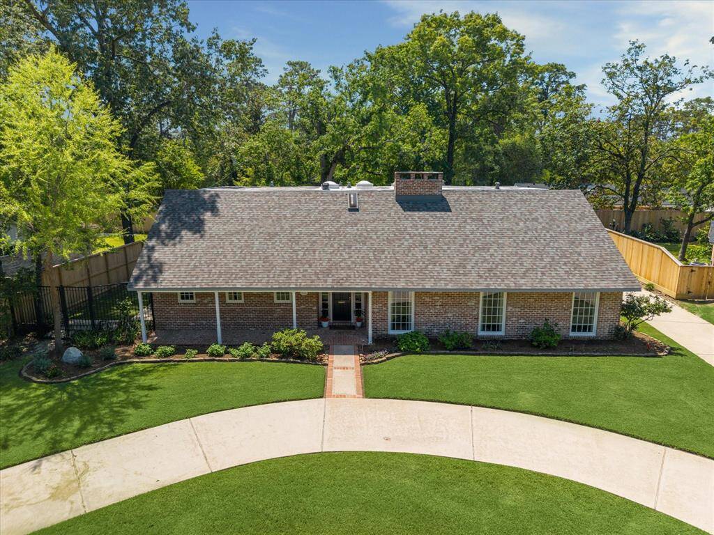 This expansive, fully gated side yard offers privacy and flexibility for pets, play, or relaxation. French doors from the study open directly into this serene green space. It’s an outdoor escape that lives like an extension of the home.