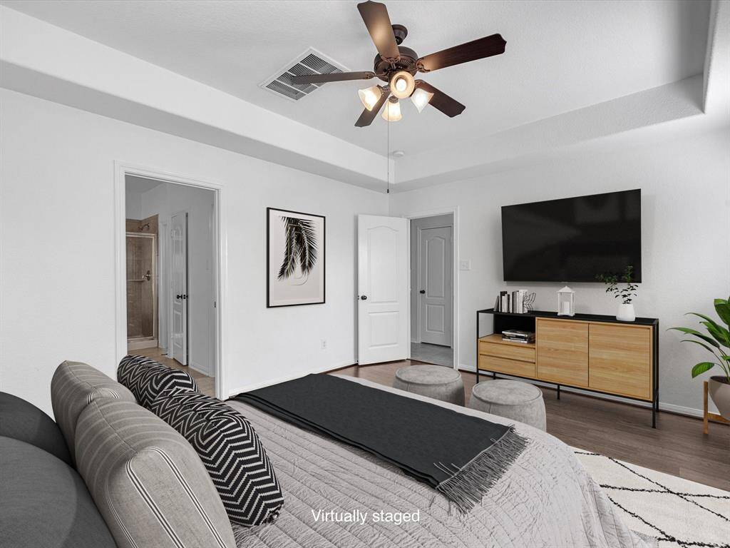 A tray ceiling offers extra height and an airy feel.