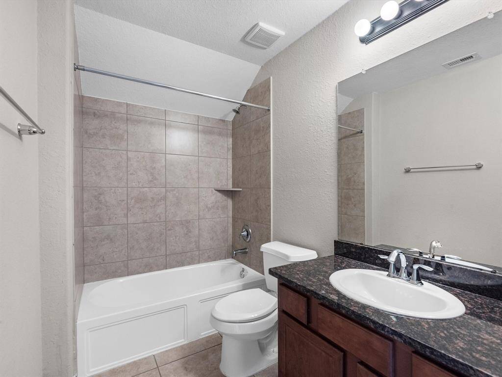 The third full bathroom is located on the second floor and features a tub/shower combo, single vanity and linen closet.