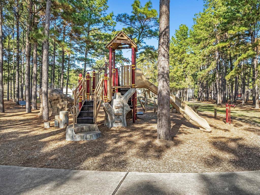 Jagged Ridge Park is only 0.3 miles away and offers a wonderful shaded playground for those hot Woodlands days.