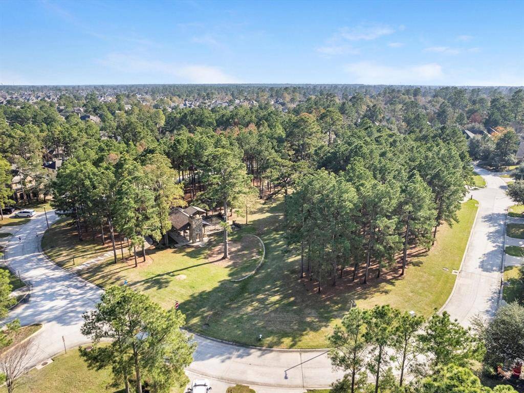 A unique aspect of The Woodlands is all the nature and foliage, and you can see that is preserved here. Lots of trees and shade surrounding the park.