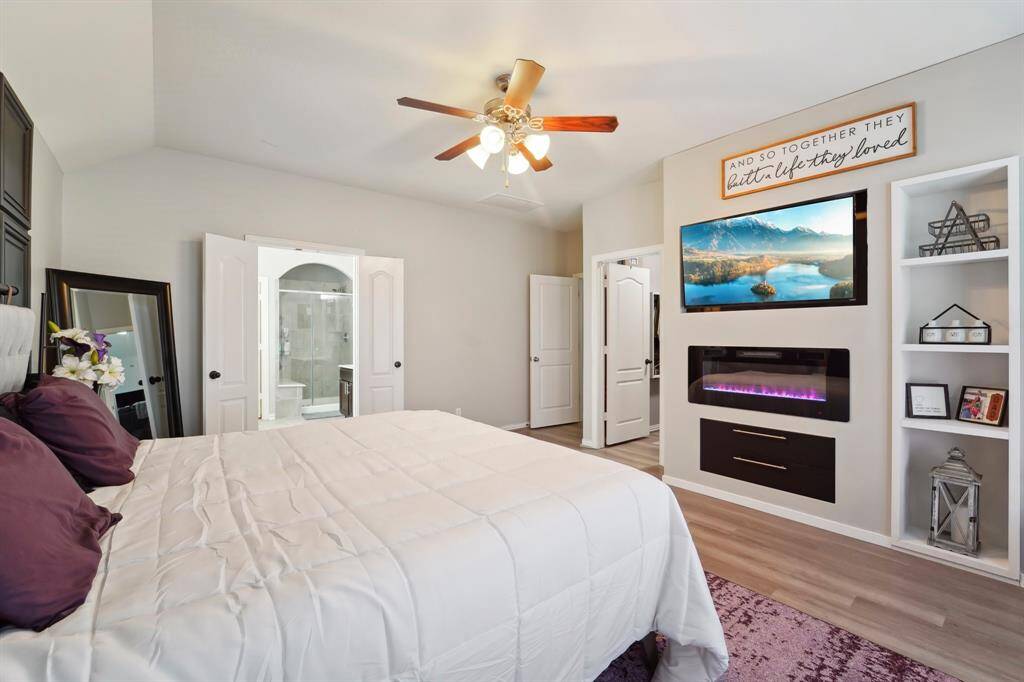 Spacious Master Suite with custom built in entertainment center.