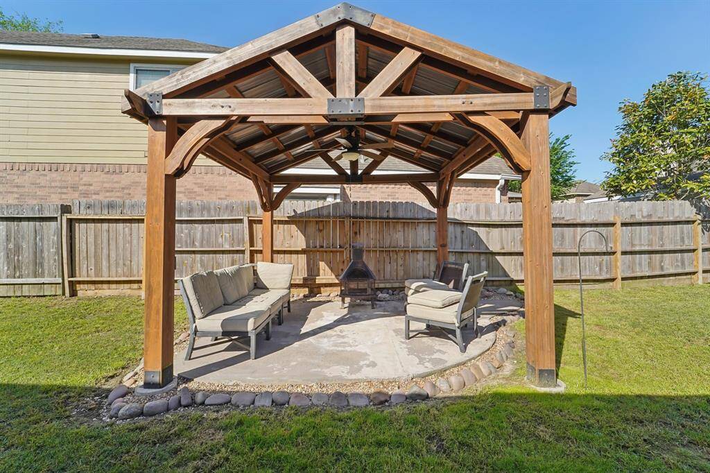 Custom built covered sitting area perfect for grilling or hosting parties!