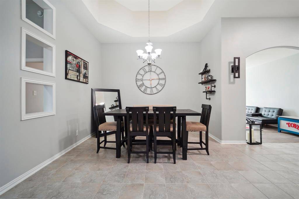 Vaulted ceiling breakfast nook adds a custom feel.