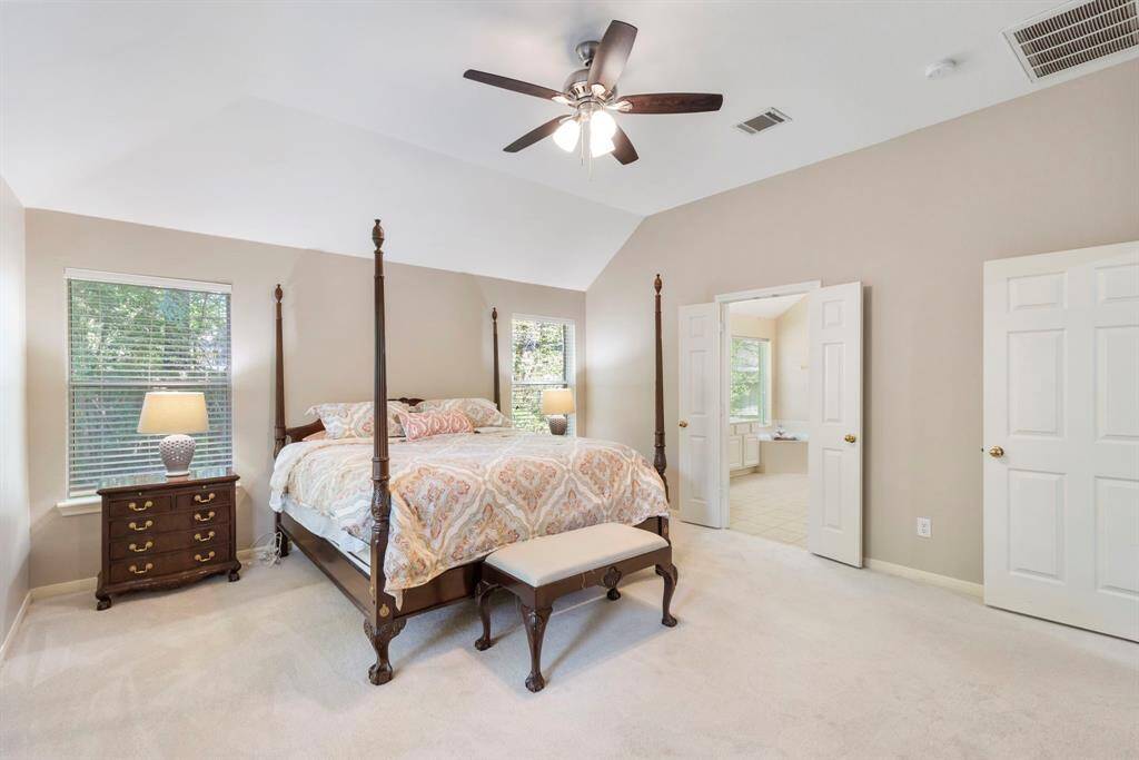 You have to check out the primary closet: it showcases soaring ceilings and built-in floor-to-ceiling shelving for effortless organization.