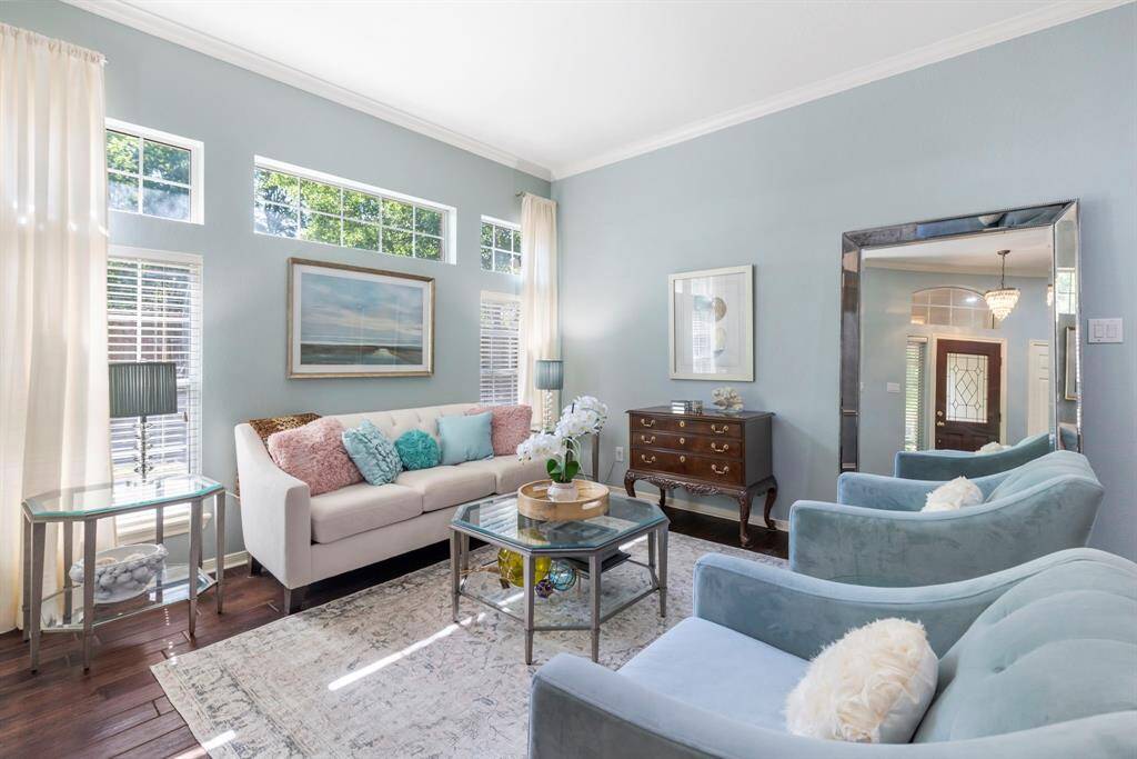 The formal living room is a welcoming space to host gatherings with friends and family.