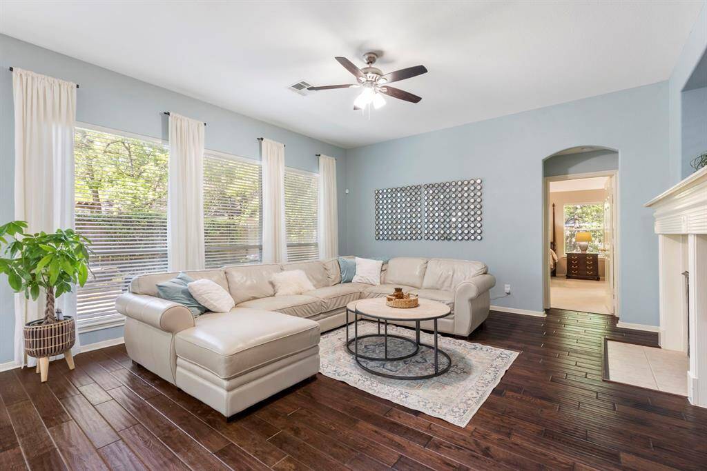 The family room is also filled with natural light. Large windows overlook the back patio.