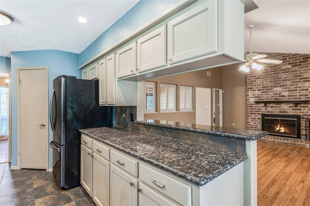 VIEW FROM KITCHEN TO FAMILY ROOM.