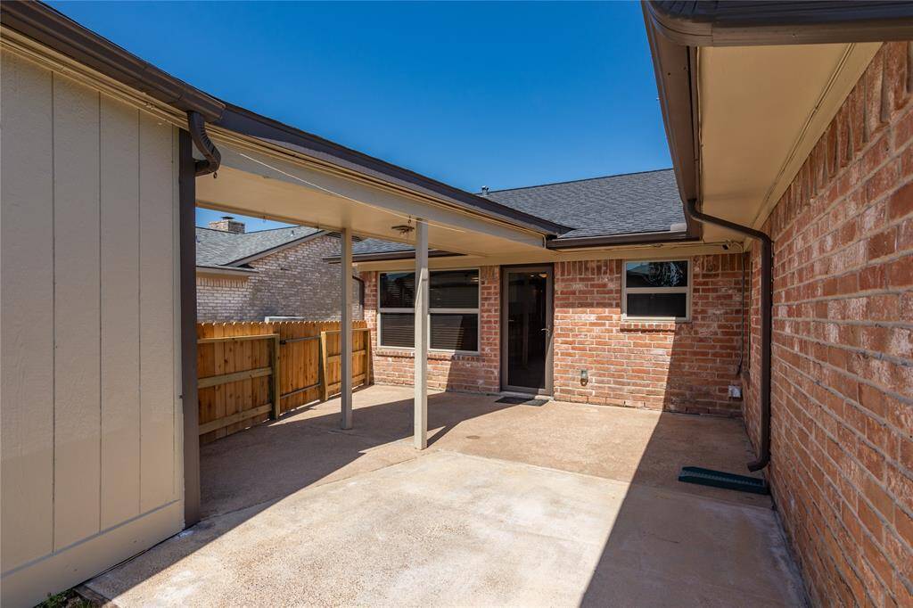GREAT PATIO AREA W/ COVERED WALKWAY TO DETACHED GARAGE.