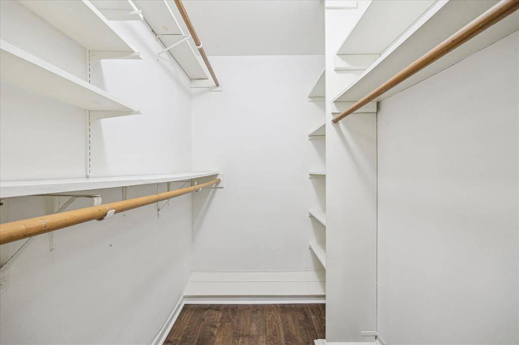 Look at this amazing walk -in primary closet, unheard of for this age home.