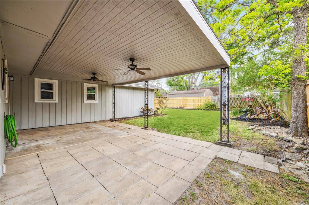 Expansive covered back porch off kitchen and dining area. Plenty of room for an outdoor kitchen, patio furniture and more. It's an open canvas.