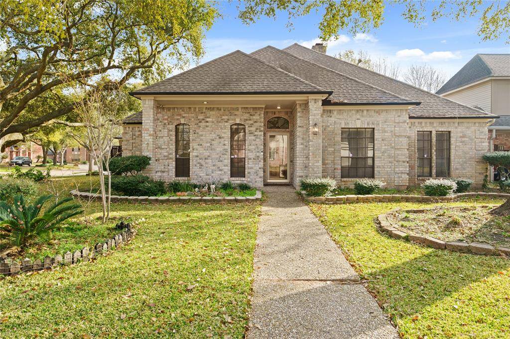 Welcome to this stunning brick-front home, where timeless elegance meets modern comfort! Nestled under the shade of mature trees, the beautifully landscaped yard and inviting walkway lead you to a grand entryway with a charming arched window.The covered front porch offers a warm welcome, setting the tone for the elegance within. Large windows allow for plenty of natural light, while the well-manicured greenery enhances the home's curb appeal. This picturesque exterior is just the beginning