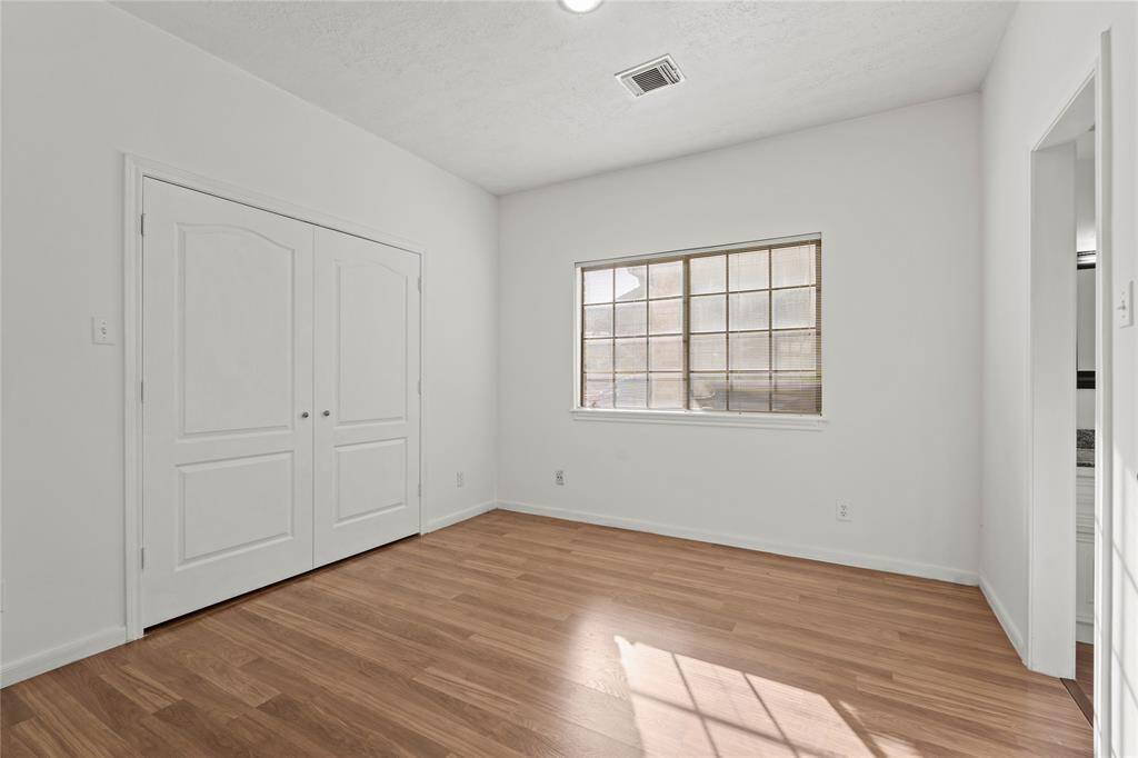 Bedroom 3: This bright and airy bedroom is a perfect blend of comfort and versatility! The large window allows natural light to pour in, creating a warm and inviting atmosphere. The soft neutral walls and sleek wood flooring provide a modern and clean look, making it easy to personalize. A spacious double-door closet offers plenty of storage for clothing and essentials. Whether used as a bedroom, guest room, or home office, this space is ready to be tailored to your needs and lifestyle!
