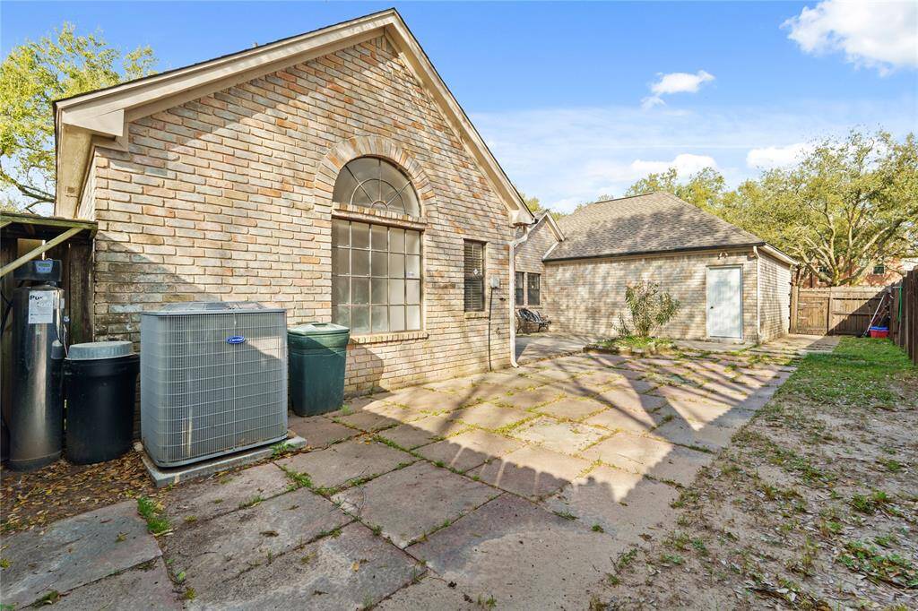 This spacious backyard area offers endless potential for outdoor enjoyment! The charming brick exterior, complemented by an elegant arched window, adds character and warmth to the space.With a large paved area, there's plenty of room for outdoor seating, dining, or even a custom garden.The fully fenced yard provides privacy, while mature trees offer a touch of natural beauty.Whether you envision hosting lively gatherings, creating a play space, or designing a peaceful retreat.
