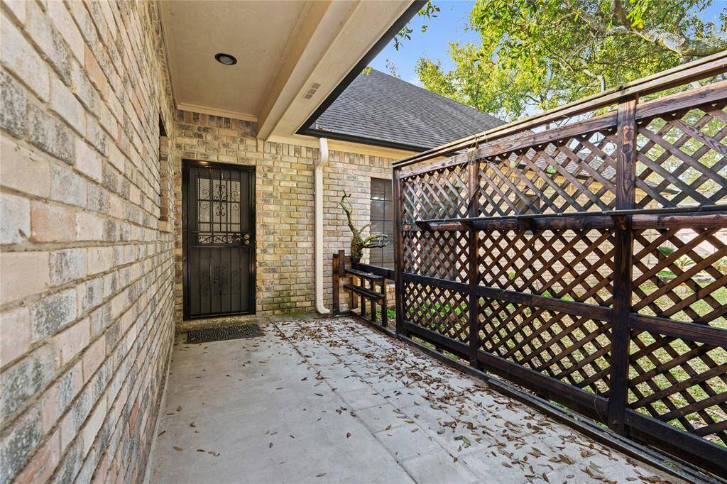 This charming private patio is a hidden gem, offering a quiet retreat with a touch of rustic elegance. The covered walkway provides shade and protection from the elements, while the decorative lattice fence adds both character and privacy.Whether you're looking for a cozy outdoor nook to enjoy your morning coffee, a space for potted plants, or an area for pets to roam safely, this courtyard-like setting is full of possibilities. With its inviting atmosphere and secluded feel