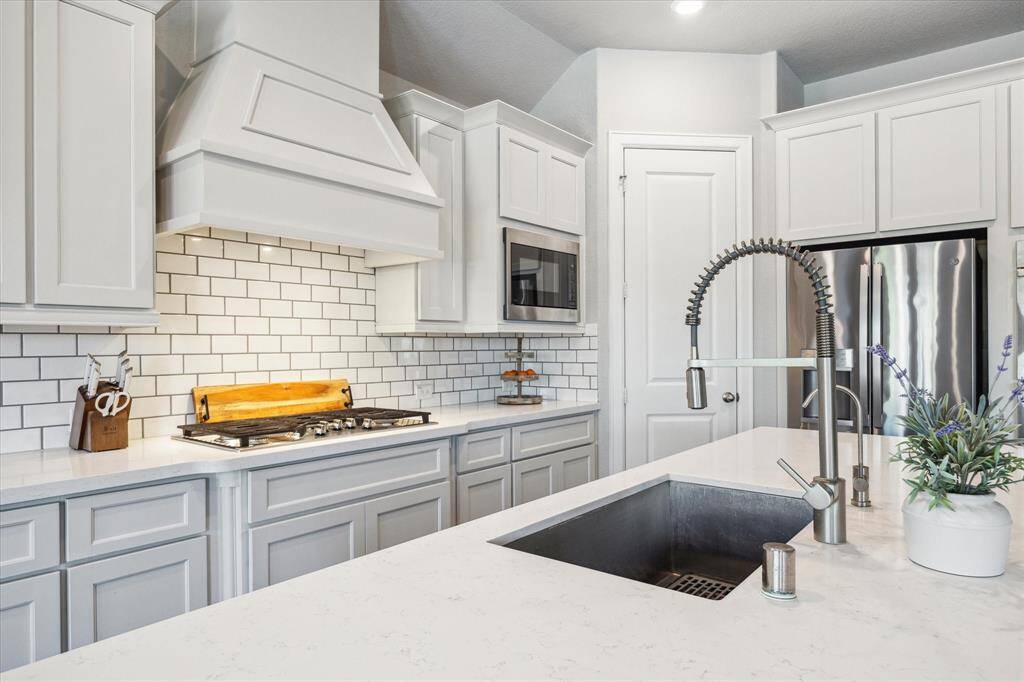 Stainless steel applicances, gas cooktop, walk in pantry and a double oven will make cooking enjoyable,
