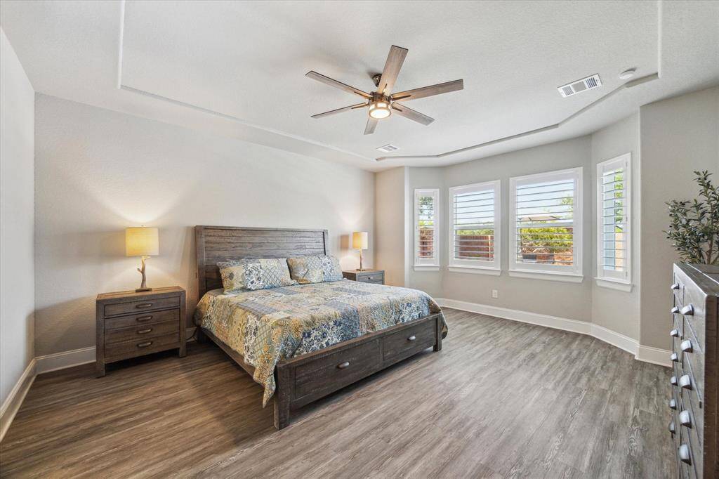 This spacious primary bedroom is a relaxing oasis after a long day!