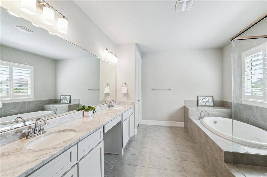 The primary bathroom is perfect to soak away the stress of the day.