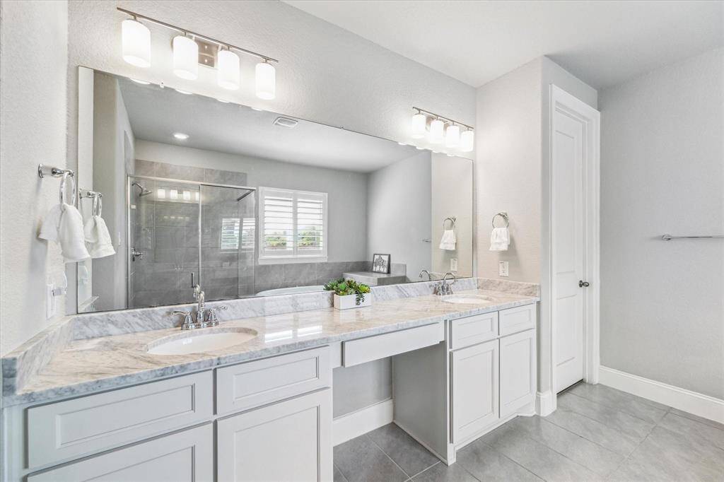 The double sinks, and plenty of countertop space will make getting ready for the day stress free.