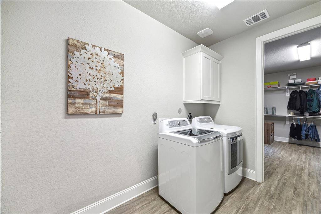 The utility room is located off the primary closet.  Putting away laundry just became a whole lot easier.