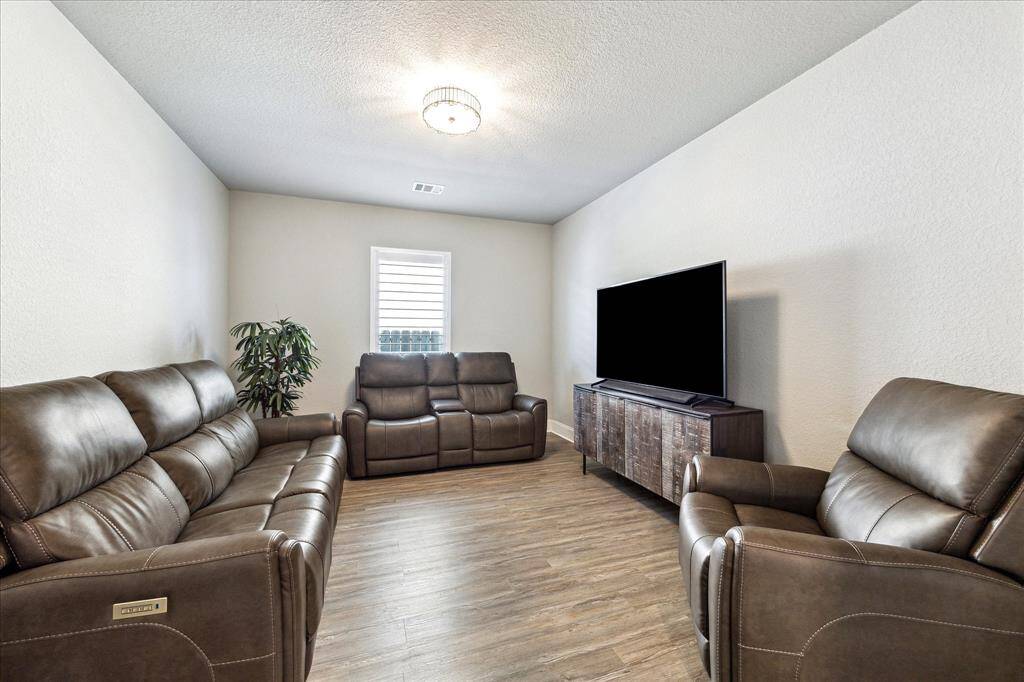 This flex room is currently being used as a media room.  It has beautiful french glass doors so you can decide what it will be.  Will it be a gameroom, study or even a dinning room the possibilities are endless.