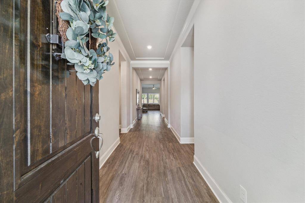 Once you enter this home your are greeted with tall ceilings and beutiful vinyl plank flooring that continues throughout the home.