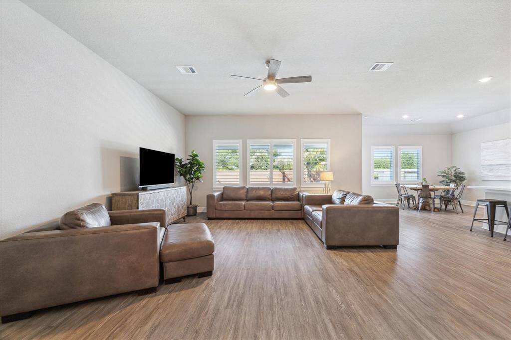 Abundant natural light flows through the upgraded plantation shutters.