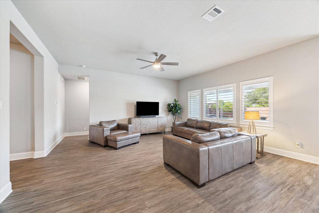 The spacious family room is perfect for game nights or sitting around and watching your favorite movie.