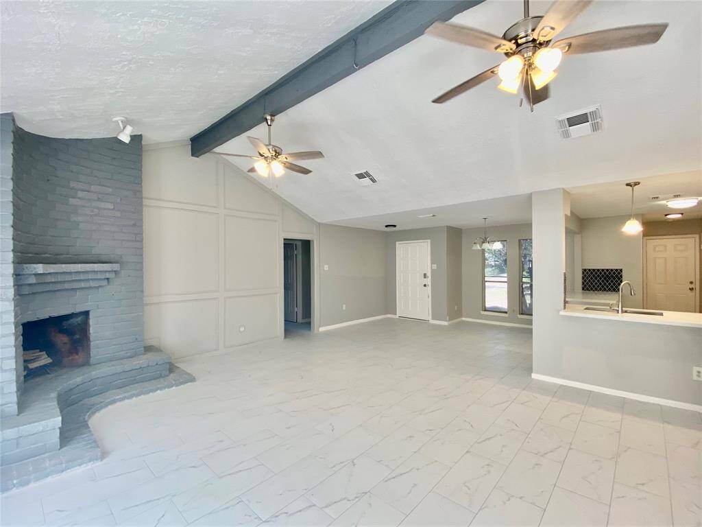 Family room with view of entrance, formal dining and kitchen...Old photo...