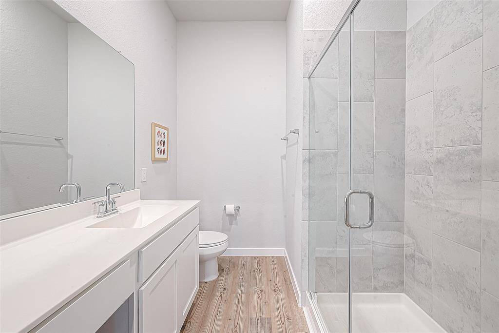 View of primary bathroom with walk-in shower.