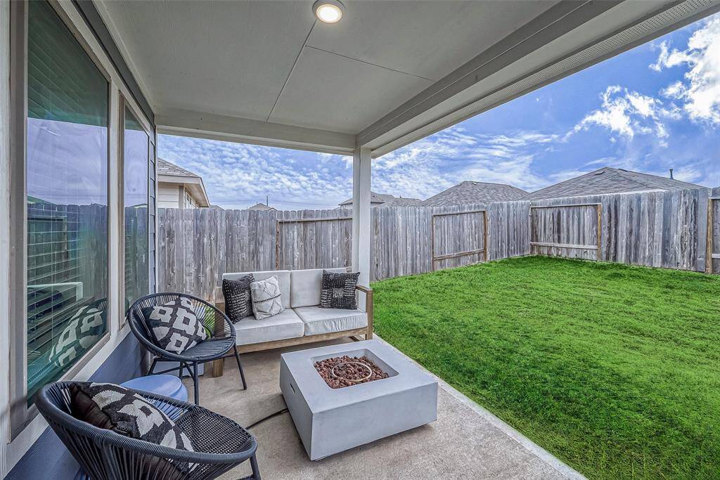 View of covered, back patio. (Lawn virtually enhanced)(Lawn virtually enhanced)