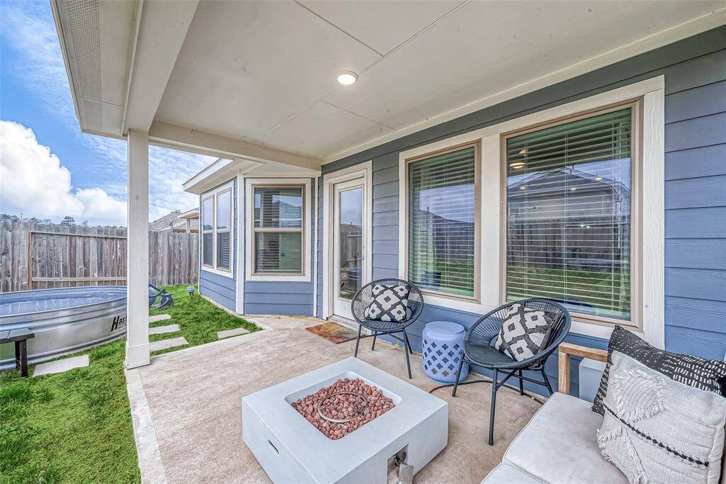 Alternate view of covered, back patio.(Lawn virtually enhanced)