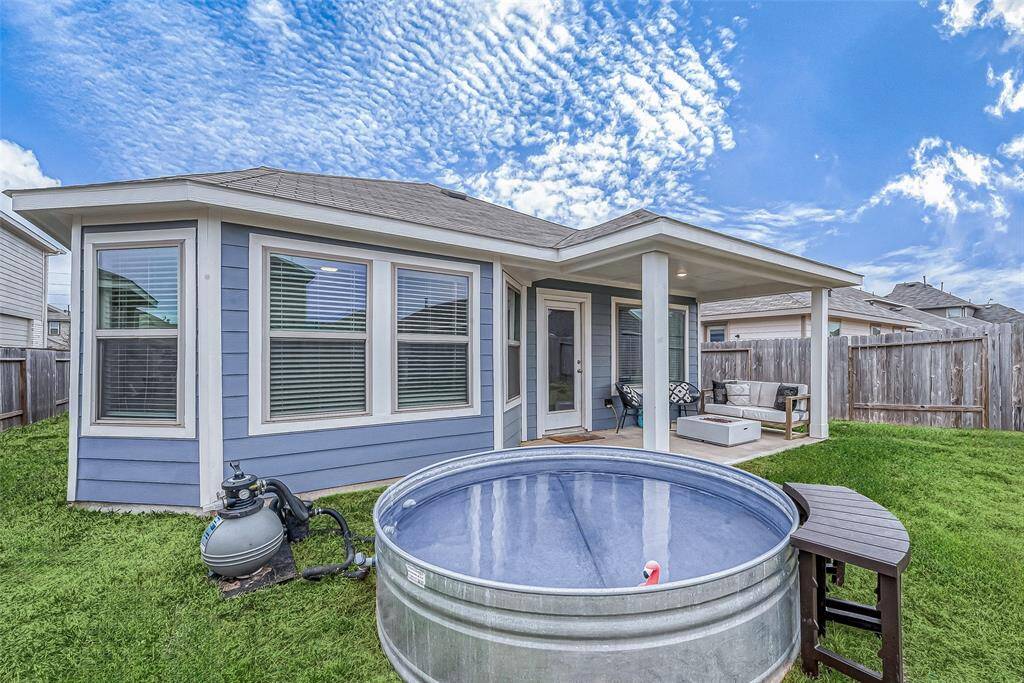 View of stock tank pool.(Lawn virtually enhanced)